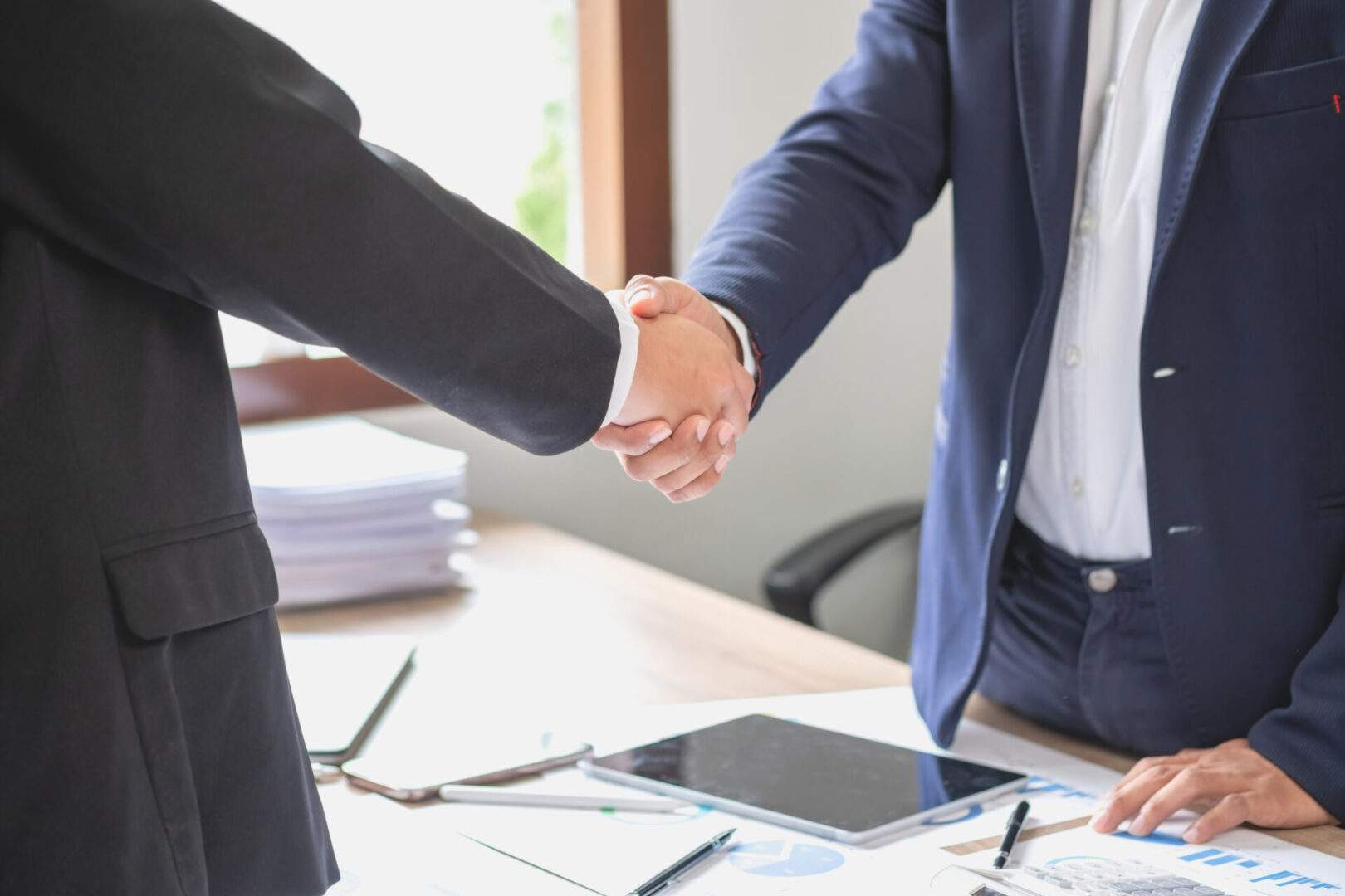 two business men shake hands for business cooperation